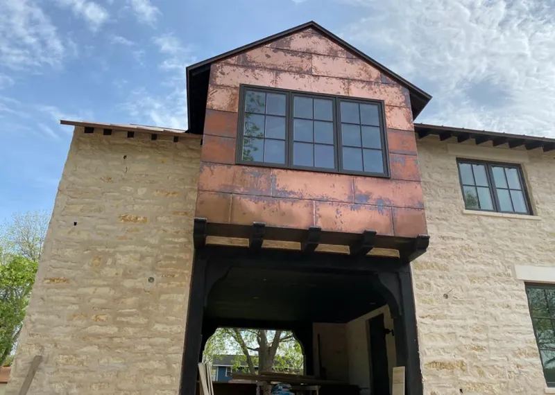 Copper metal panel facade on a stone building for Metal Roof Coating in Lebanon